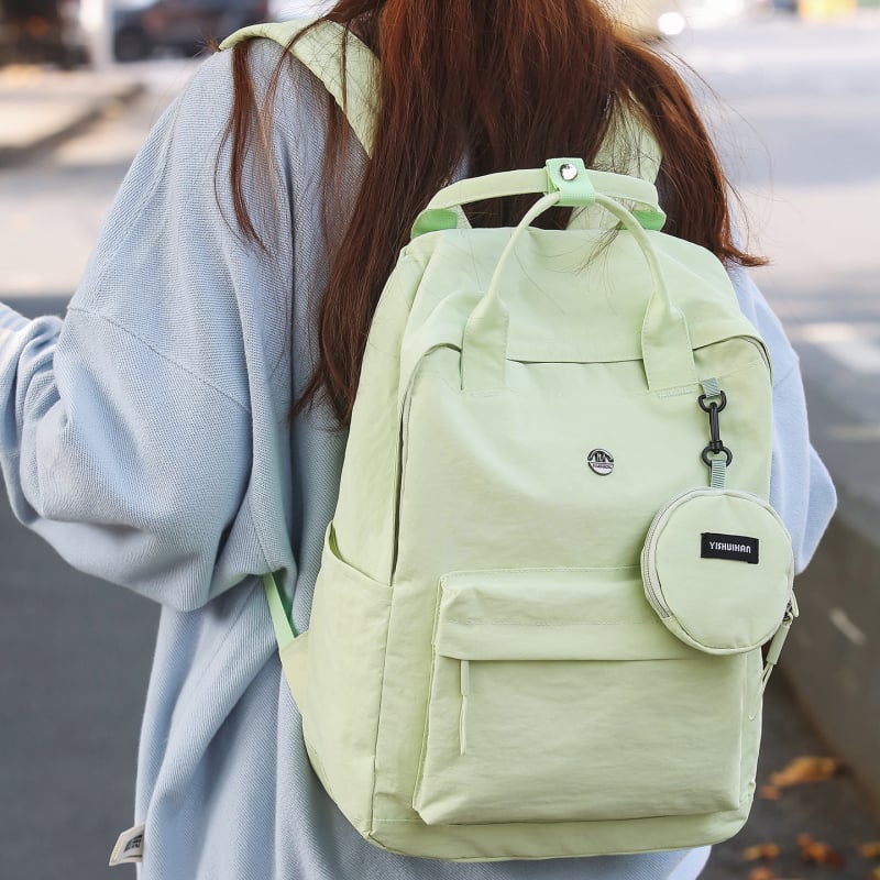 Stilizirani studentski ruksak velikog kapaciteta za svakodnevno korištenje i putovanja, minimalistički dizajn u jednoj boji, pogodan za 14-inčni laptop