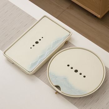 Set de ceai ceramic cu glazură cremă, ceainic cu capac, bol de infuzie cu capac, 6 cești și tavă de servire.