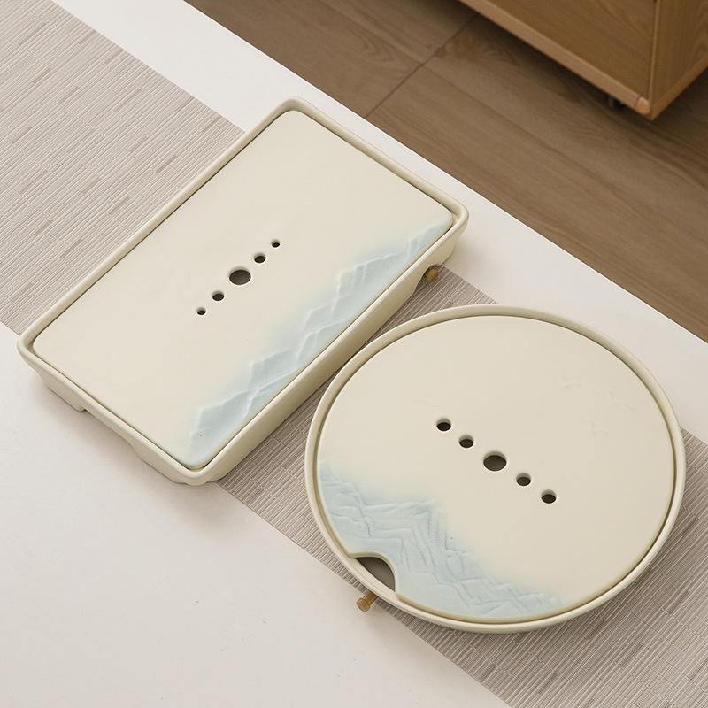 Set de ceai ceramic cu glazură cremă, ceainic cu capac, bol de infuzie cu capac, 6 cești și tavă de servire.