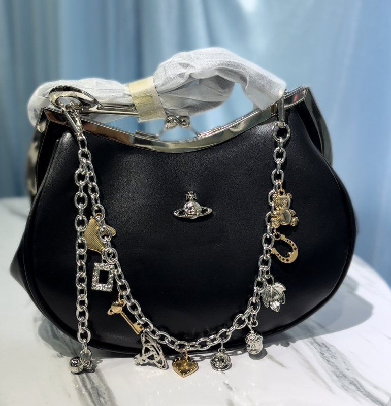 2025 novi stil Zapadno-Pacifička Saturn dumpling torba s lancem i kopčom, torba preko ramena, ženska crossbody torba, francuski inspiriran visoke klase s napuknutom teksturom
