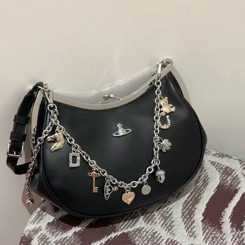 2025 novi stil Zapadno-Pacifička Saturn dumpling torba s lancem i kopčom, torba preko ramena, ženska crossbody torba, francuski inspiriran visoke klase s napuknutom teksturom