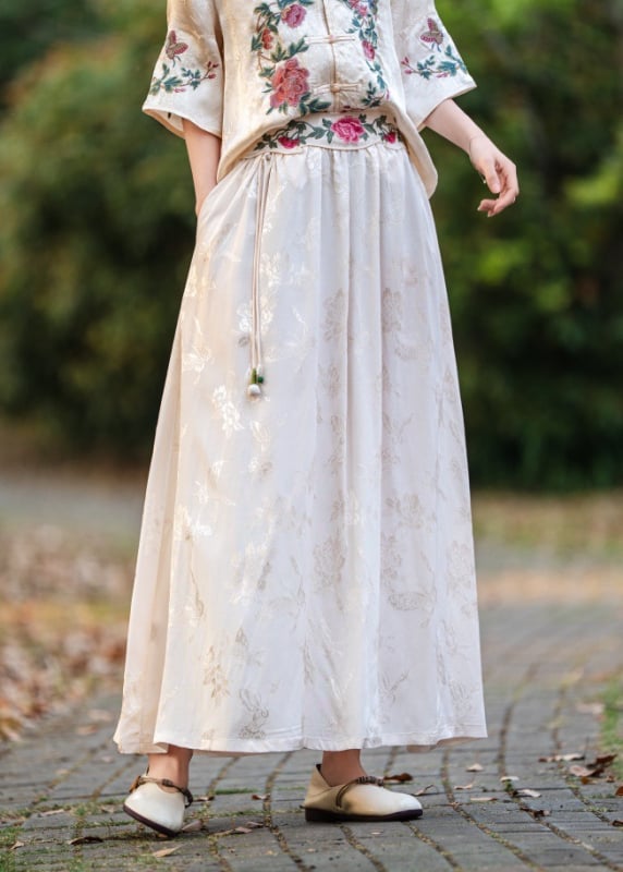 Satenova suknja s jacquardom, A‑linije midi duljine, elastičan pojas, etnički stil
