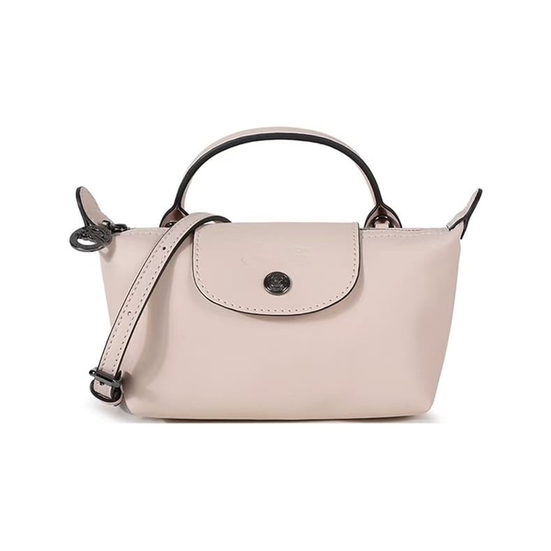 Bőr mini dumpling táska kapcsos fedéllel, belső cipzáros zsebbel, váll- és crossbody pánttal, telefon- és sminktáska, női táska