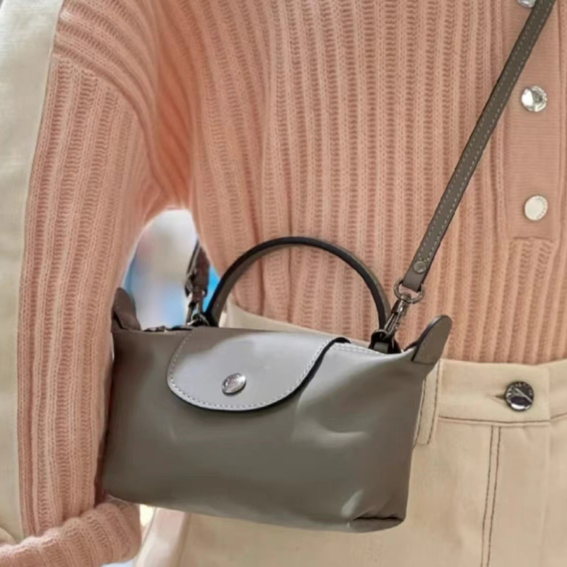 Mini PU dumpling torbica s jednom ručkom; može se nositi preko ramena ili kao crossbody; kompaktna ženska torbica za telefon i kozmetiku.