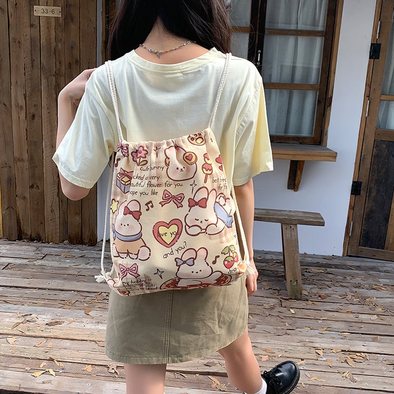 Retro nyuszis rajzokkal készült drawstring hátizsák vászonból, nagy kapacitású, nőknek, utazáshoz és iskolába, 2025 kiadás