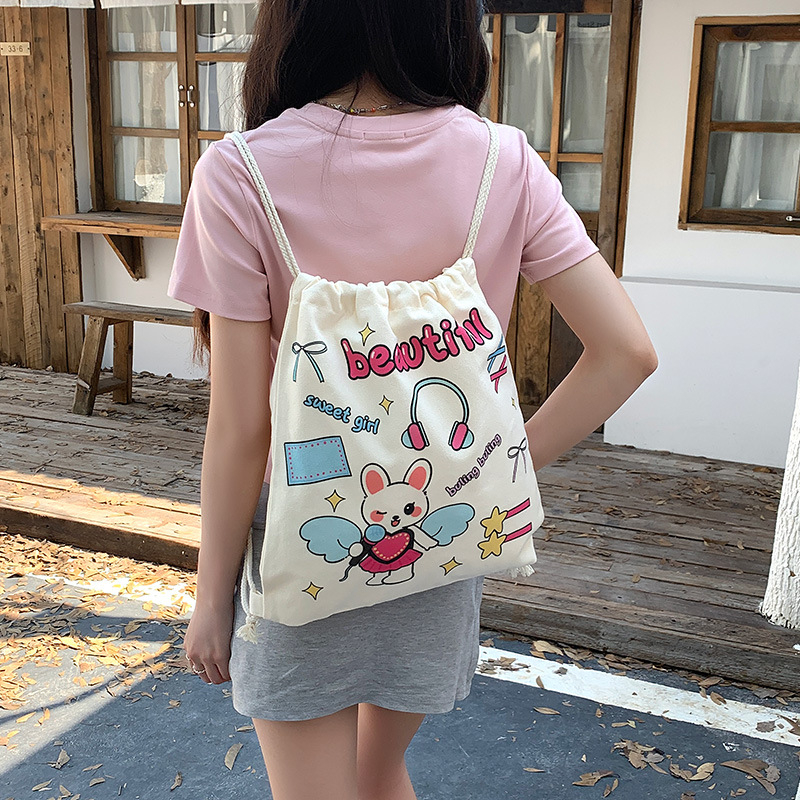 Retro nyuszis rajzokkal készült drawstring hátizsák vászonból, nagy kapacitású, nőknek, utazáshoz és iskolába, 2025 kiadás