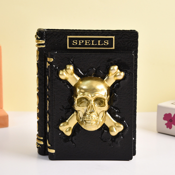 Halloween stolová ozdoba z živice – reliéfna lebka na knihe, 3D magická kniha