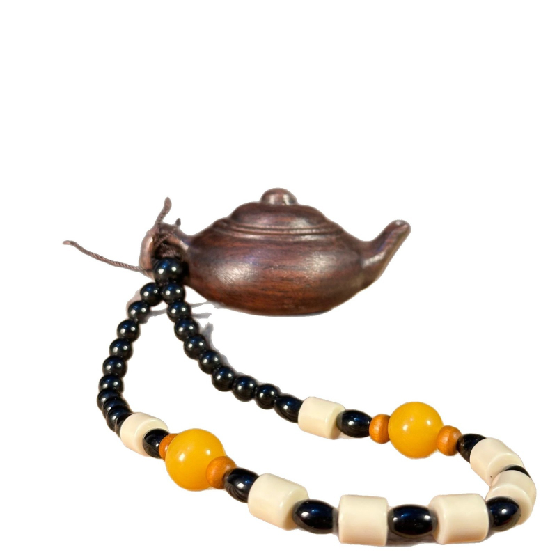 Ručne vyrezávaný ebenový drevený prívesok