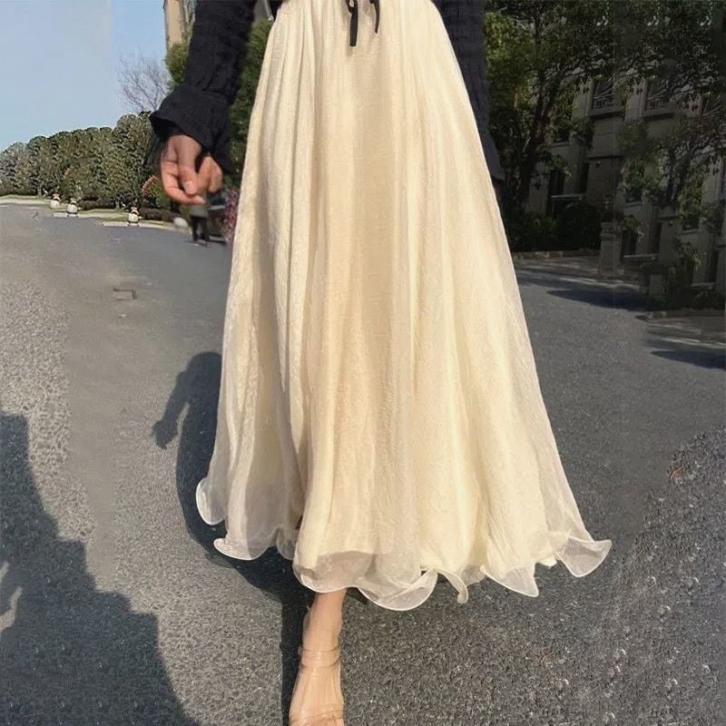Μακριά φούστα chiffon με oversize γραμμή, κυματοειδή άκρη και λαμπερή όψη