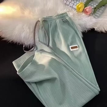 Muške sportske hlače s waflovim uzorkom, slobodnog kroja, ravne, visokog struka, široke nogavice, s etiketom, casual stil.