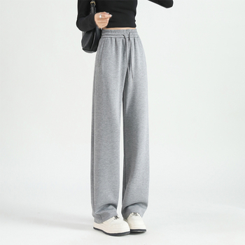 Jesenje ženske hlače s kopčama i džepovima, opušten kroj, ravne do širokih nogavica, casual sportski stil