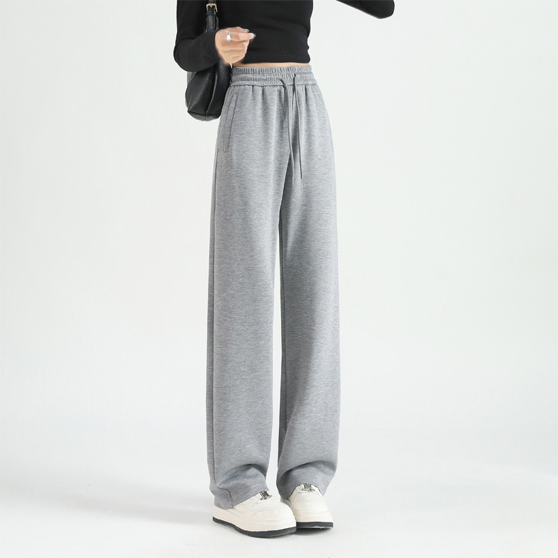 Jesenje ženske hlače s kopčama i džepovima, opušten kroj, ravne do širokih nogavica, casual sportski stil