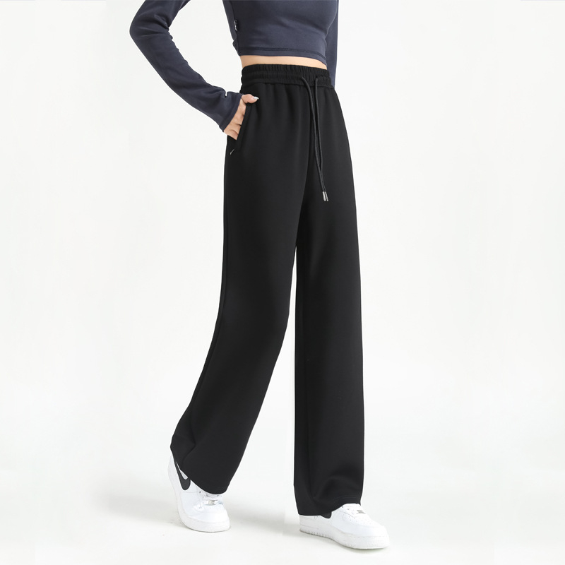 Jesenje ženske hlače s kopčama i džepovima, opušten kroj, ravne do širokih nogavica, casual sportski stil