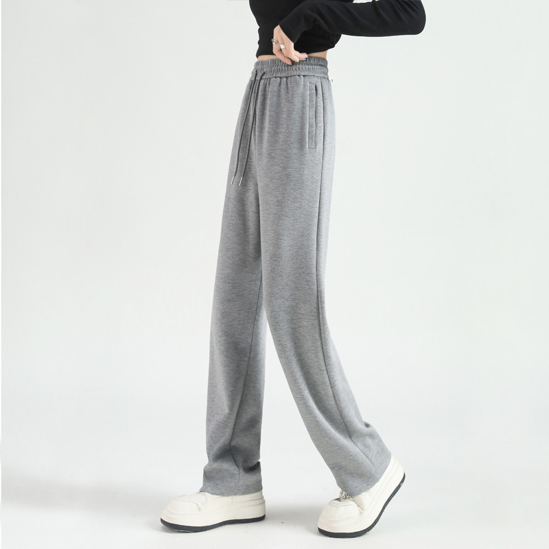 Jesenje ženske hlače s kopčama i džepovima, opušten kroj, ravne do širokih nogavica, casual sportski stil