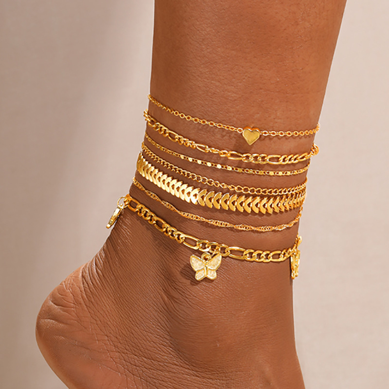 Zlatni ton anklet s privjeskom srca i leptira, višeslojni set od 7 komada