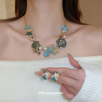 Set naušnica i lančić za ključnu kost; motivi oceanskog života: morska zvijezda, školjka, koral; rhinestones; ručna izrada; luksuzni komadi