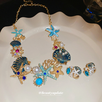 Set naušnica i lančić za ključnu kost; motivi oceanskog života: morska zvijezda, školjka, koral; rhinestones; ručna izrada; luksuzni komadi