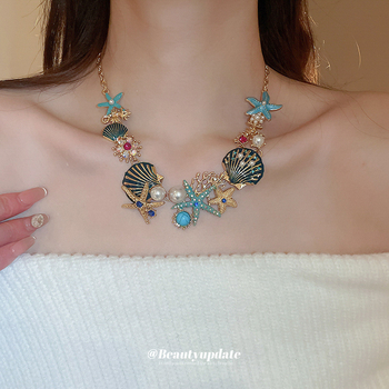 Set naušnica i lančić za ključnu kost; motivi oceanskog života: morska zvijezda, školjka, koral; rhinestones; ručna izrada; luksuzni komadi