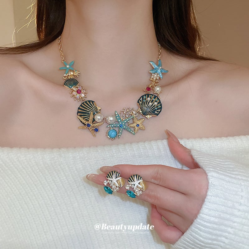 Set naušnica i lančić za ključnu kost; motivi oceanskog života: morska zvijezda, školjka, koral; rhinestones; ručna izrada; luksuzni komadi