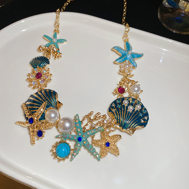 Set naušnica i lančić za ključnu kost; motivi oceanskog života: morska zvijezda, školjka, koral; rhinestones; ručna izrada; luksuzni komadi