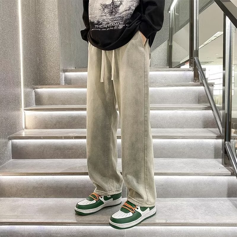 Férfi denimnadrág sárga iszapfestéssel, lazán szabott egyenes szabású, amerikai stílusú, retro streetwear