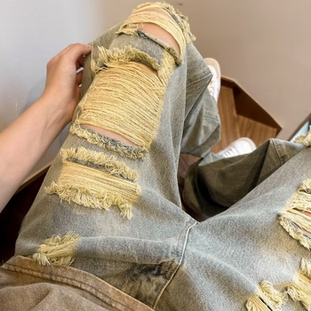 2026 Amerikai stílusú, több zsebes, dekonstruált munkás farmernadrág férfiaknak, őszi trend, laza szabás, mosott denim, széles szár