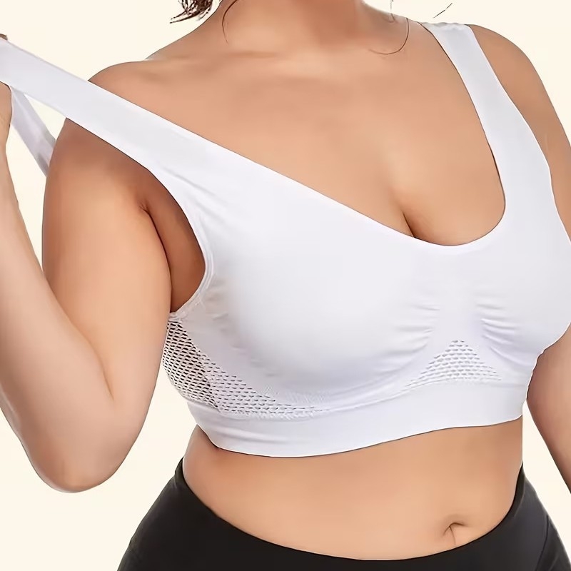 Plus-size bezdrôtová športová podprsenka jednofarebná, perforovaný dizajn, priedušná, bezšvová, push-up, zdvih a kontrola bočných