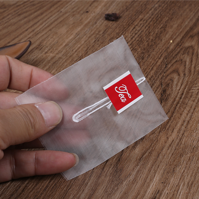 Pungi de ceai triunghiulare din nylon, de calitate alimentară, cu plasă filtrantă și sigilare termică.