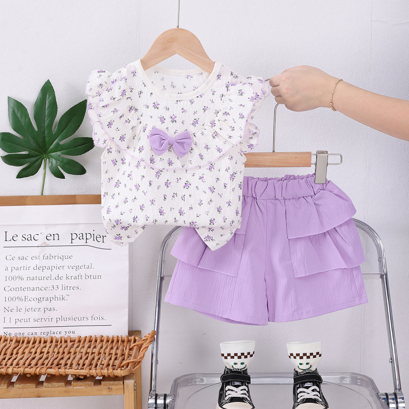 Set de două piese pentru fete, vară 2025, top cu mâneci scurte și pantaloni scurți, imprimeu floral allover cu fundă și guler mare.