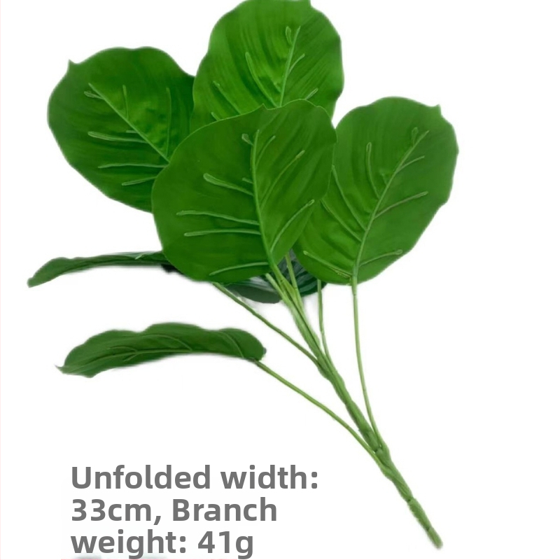 Umelá zelená rastlina bonsai s taro a zeleným jablkom na dekoráciu interiérového stola