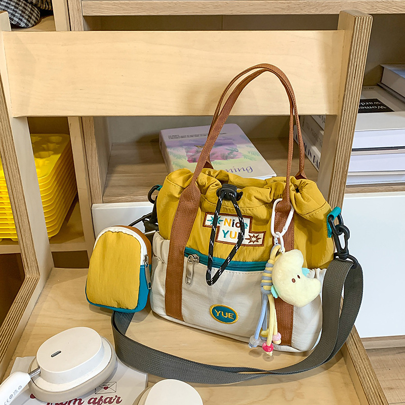 Geantă crossbody pentru femei, stil coreean 2025, bucket color-block, capacitate mare, pentru studente