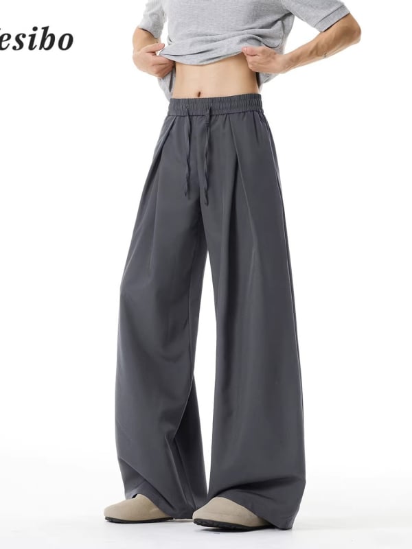 Pantaloni casual subțiri, uni, de vară, cu pliuri și șiret în talie, croială dreaptă spre largă, lungi