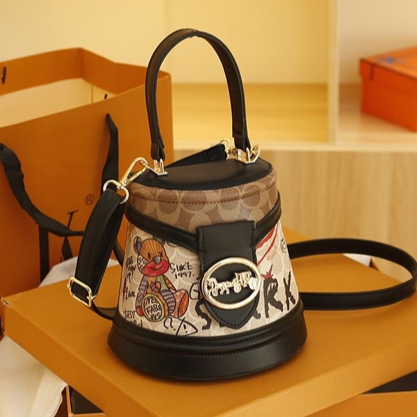 Geantă bucket 2024 nouă, design cu urs de desene animate, model graffiti, formă cilindrică, geantă de umăr premium
