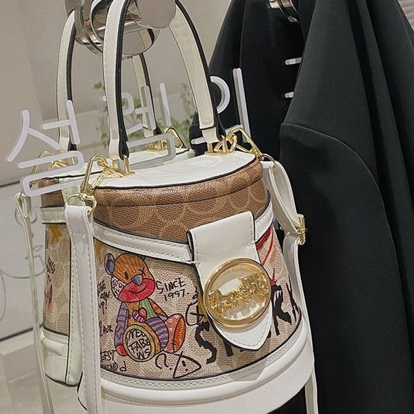 Geantă bucket 2024 nouă, design cu urs de desene animate, model graffiti, formă cilindrică, geantă de umăr premium