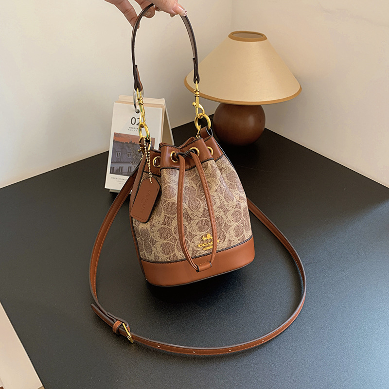 Geantă bucket pentru femei din PU, imprimeu, mică, model nou 2025, crossbody cu șnur, textură premium