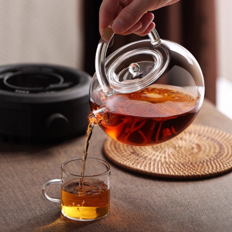 Ceainic din sticlă borosilicată cu mâner, design floral, rezistent la căldură, stil modern minimalist