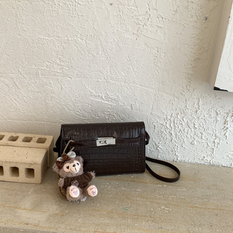 Geantă de damă în primăvara 2026, stil urban minimalist, PU, crossbody cu clapă, formă pătrată mică, dimensiune medie