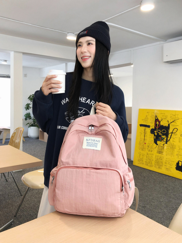 Korejski stil Harajuku ruksak, jednostavnog jednobojnog dizajna, velik kapacitet, lagan i svestran za učenike srednjih i visokih škola te studente; kompatibilan s 14-inčnim laptopom, vodootporan najlon.