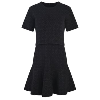 Set din două piese: top cu mânecă scurtă și guler rotund, în imprimeu retro, și fustă în stil fishtail cu margine în formă de frunză de lotus