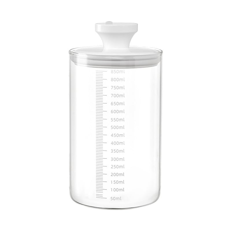 Borcan din sticlă cu capac de apăsare pentru depozitare în bucătărie a cerealelor, plantelor medicinale, ceaiului, cafelei, pudrei de lapte și fructelor uscate; rezistent la umezeală; capacitate 501–800 ml.