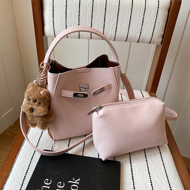 Geantă bucket pentru femei, crossbody, din PU, textură lychee, mărime medie, închidere magnetică, buzunar interior cu fermoar, utilizare zilnică, primăvara 2026.
