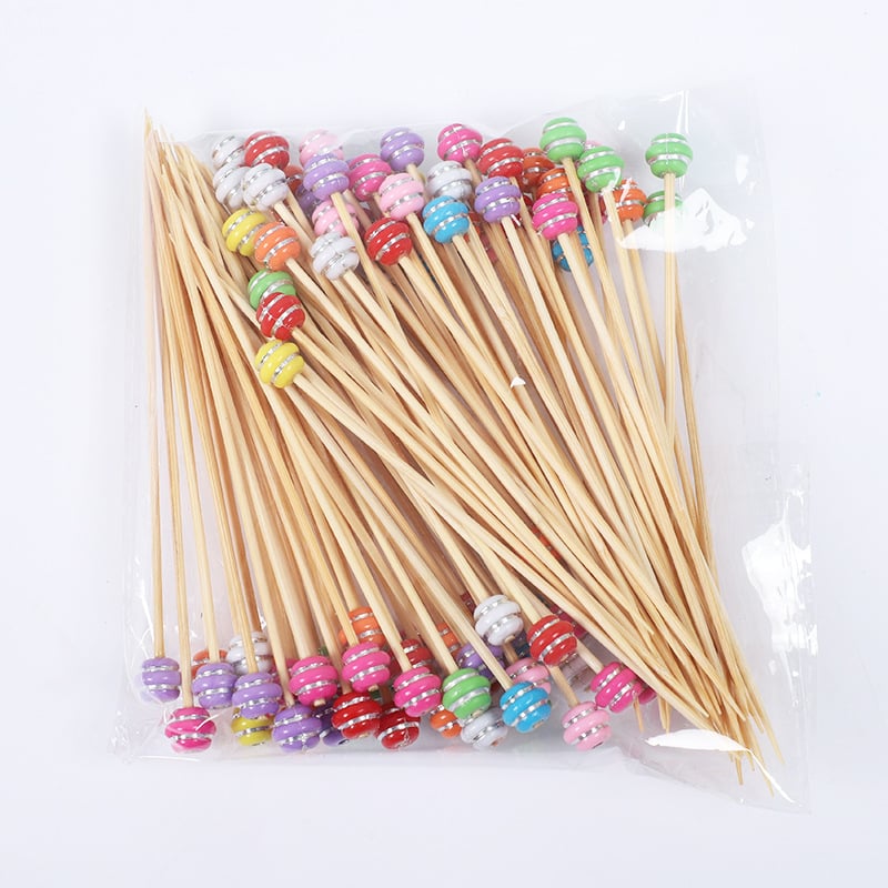 Bețișoare de fructe de unică folosință, cu design floral drăguț pe bețe de bambus, ideale pentru deserturi, sushi și decorarea fructelor.