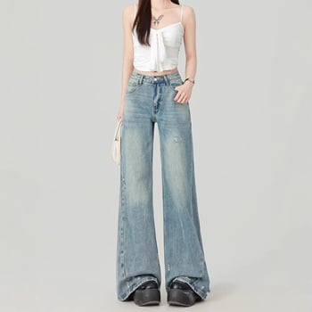 Blugi albastru deschis, talie înaltă, croi lejer, denim spălat, siluetă evazată cu picior larg