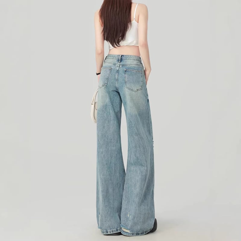 Blugi albastru deschis, talie înaltă, croi lejer, denim spălat, siluetă evazată cu picior larg