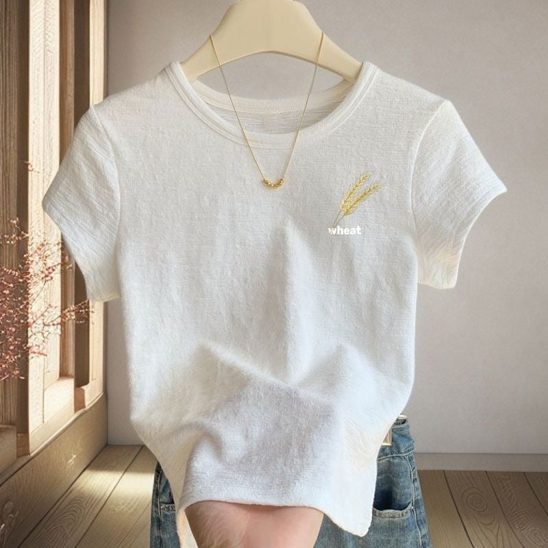 Tricou alb dama cu textură, mâneci scurte, guler rotund, croială lejeră, vară 2026 cu imprimeu desene animate