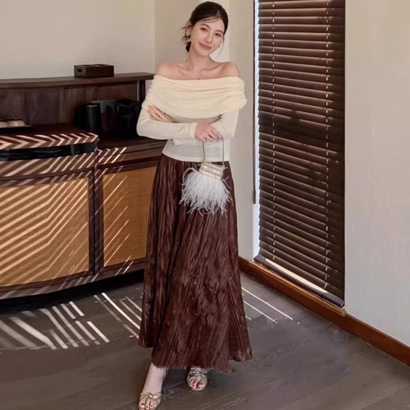 Trudničarska kožna suknja — jesenji francuski stil, retro elegantna, nepravilni plisirani detalji, srednja duljina, A-linija