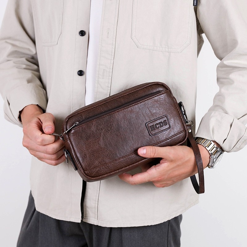 Geantă de umăr pentru bărbați, capacitate mare, casual, impermeabilă și rezistentă la uzură, crossbody cu logo, stil business casual.