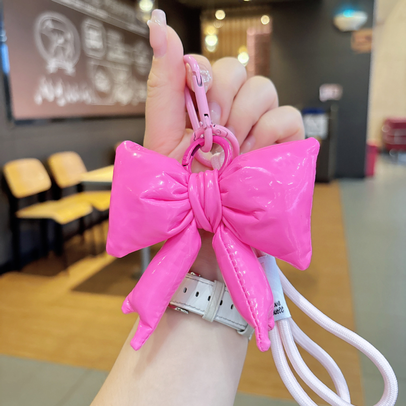 Koreai stílusú kulcstartó párnázott bőrből és nagy masnival, édes, divatos kiegészítő lányoknak