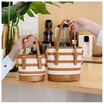 Csíkos színblokkal készült bucket táska, crossbody vállpánttal, mindennapi stílusú nőknek és gyerekeknek