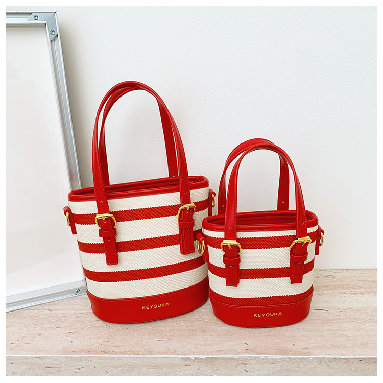 Csíkos színblokkal készült bucket táska, crossbody vállpánttal, mindennapi stílusú nőknek és gyerekeknek